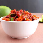 Raw mango pickle, an Indian side dish, in a bowl.